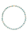 18K yellow gold station necklace featuring bezel-set, rose-cut round blue topaz gemstones arranged in a continuous line with a lobster clasp. Displayed on a white background.