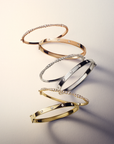 This 18k yellow gold bangle from the Moderne Deco collection by Penny Preville features round diamonds flush set in the bangle that total 0.60ctw. The bangle measures 5.8mm in thickness.