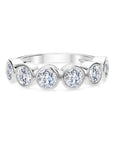 18k white gold band with bezel-set round diamonds.