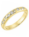 18k yellow gold band with scattered diamonds.