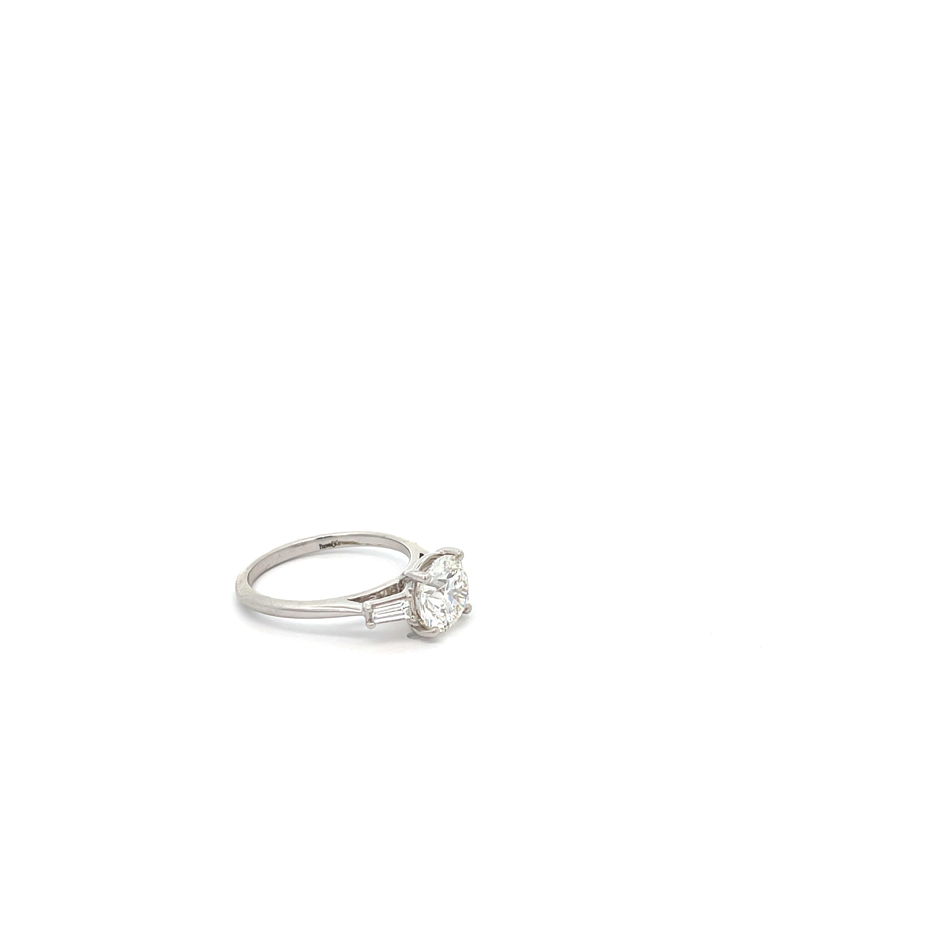 The Classic 3 18k White Gold Round Engagement Ring with Baguette Side Stones