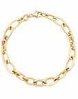 A gold chain link bracelet with a classic Figaro link pattern and a lobster clasp, shown on a plain white background.