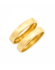 Two polished yellow gold bands, likely wedding rings, shown overlapping on a clean white background.