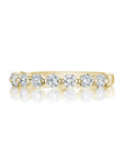 18k yellow gold band with round diamonds.