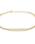 This 14k yellow gold bracelet from Zoe Chicco features a line of 10 bezel set emerald cut diamonds that total 0.96ctw. The diamonds are attached to a medium box chain that measures 6 inches in length with an adjustable chain extender.