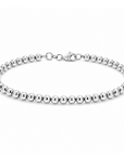This 14k white gold bracelet features small beads that are strung together to a 7.5 inch bracelet with adjustable chain clasp.
