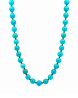 This beaded necklace features a strand of turquoise stone beads that measure 8mm in diameter each. The 16 inch strand is finished with a sterling silver magnetic ball clasp.