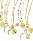 This 18K yellow gold round pendant from Penny Preville features a single round pink sapphire totaling 0.35ctw, accented by round and emerald-cut diamonds totaling 0.45ctw. The pendant is finished with a bail, allowing it to be attached to different necklaces.