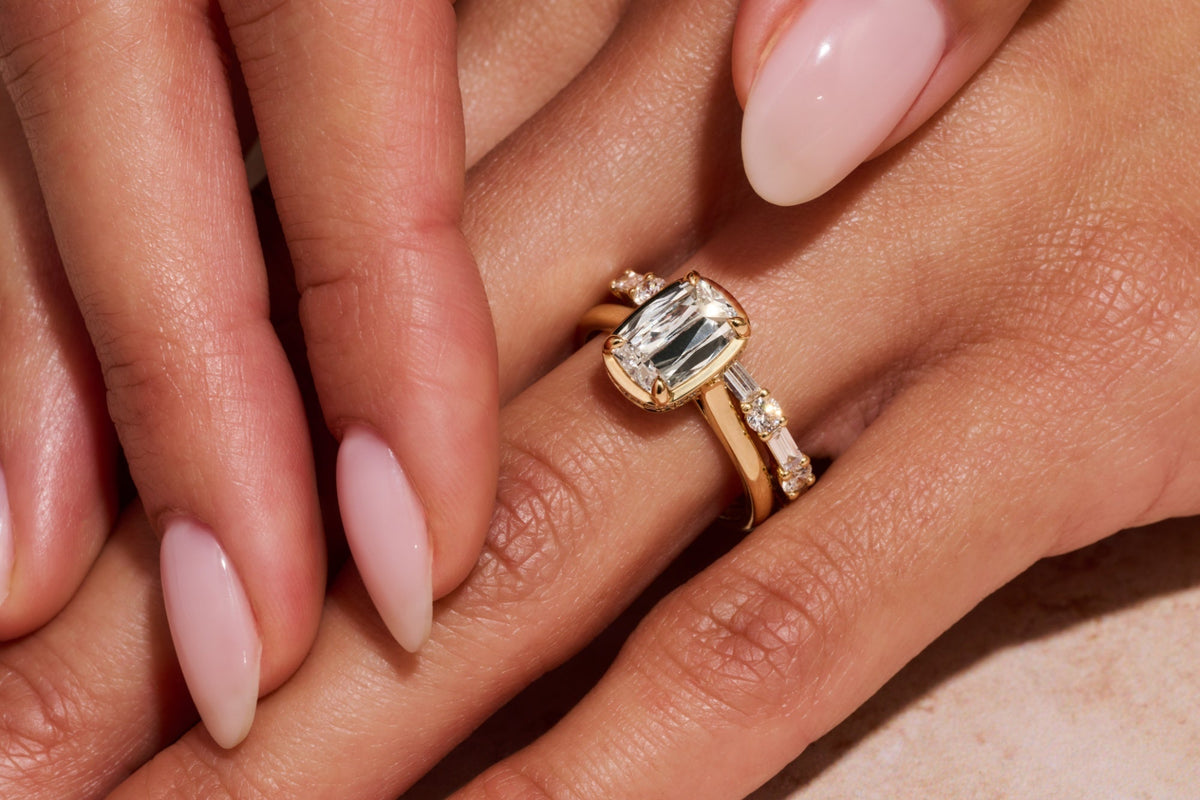 Curved band beside engagement ring