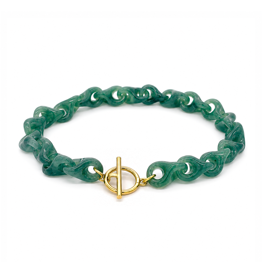 Jade link bracelet with toggle clasp in yellow gold.