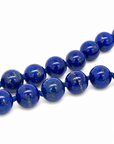 This necklace features lapis beads that measure 8mm in diameter each. This 16 inches strand is finished with a sterling silver charm ring.