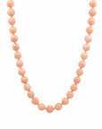 This beaded necklace features a strand of orange moonstone beads that measure 8mm in diameter each. The 16 inch strand is finished with a magnetic ball clasp.