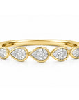 This 18k yellow gold band features five bezel set pear diamonds that total 1.01ctw. This ring measures as a size 6.5.