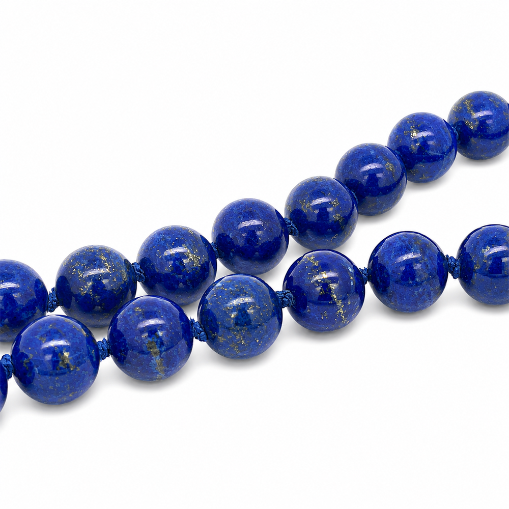This necklace features lapis beads that measure 8mm in diameter each. This 18 inches strand is finished with a sterling silver magnetic clasp.