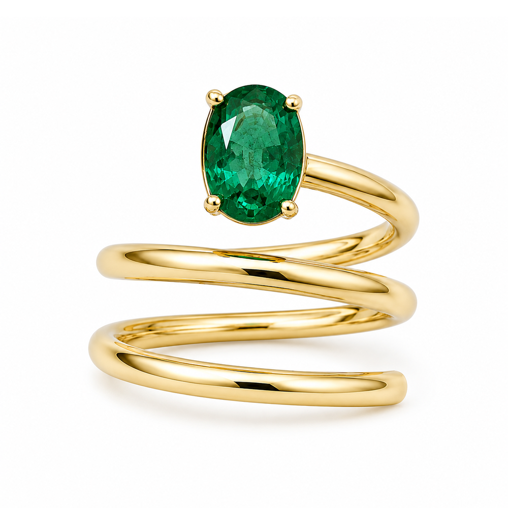 Looped yellow gold ring with an oval cut emerald gemstone set on the top of the ring.