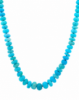 This beaded necklace showcases graduated blue opal gemstones, with the largest stones centered. The strand is finished with a sterling silver magnetic clasp and measures 16 inches. Wear this necklace on its own or as the statement piece for a layered necklace stack.
