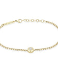 This 14k yellow gold bracelet from Zoe Chicco features a center bezel set diamond that totals 0.10ctw that is set on a box chain. The bracelet measures 6 inches in length with an adjustable chain extender. Shown on white background.