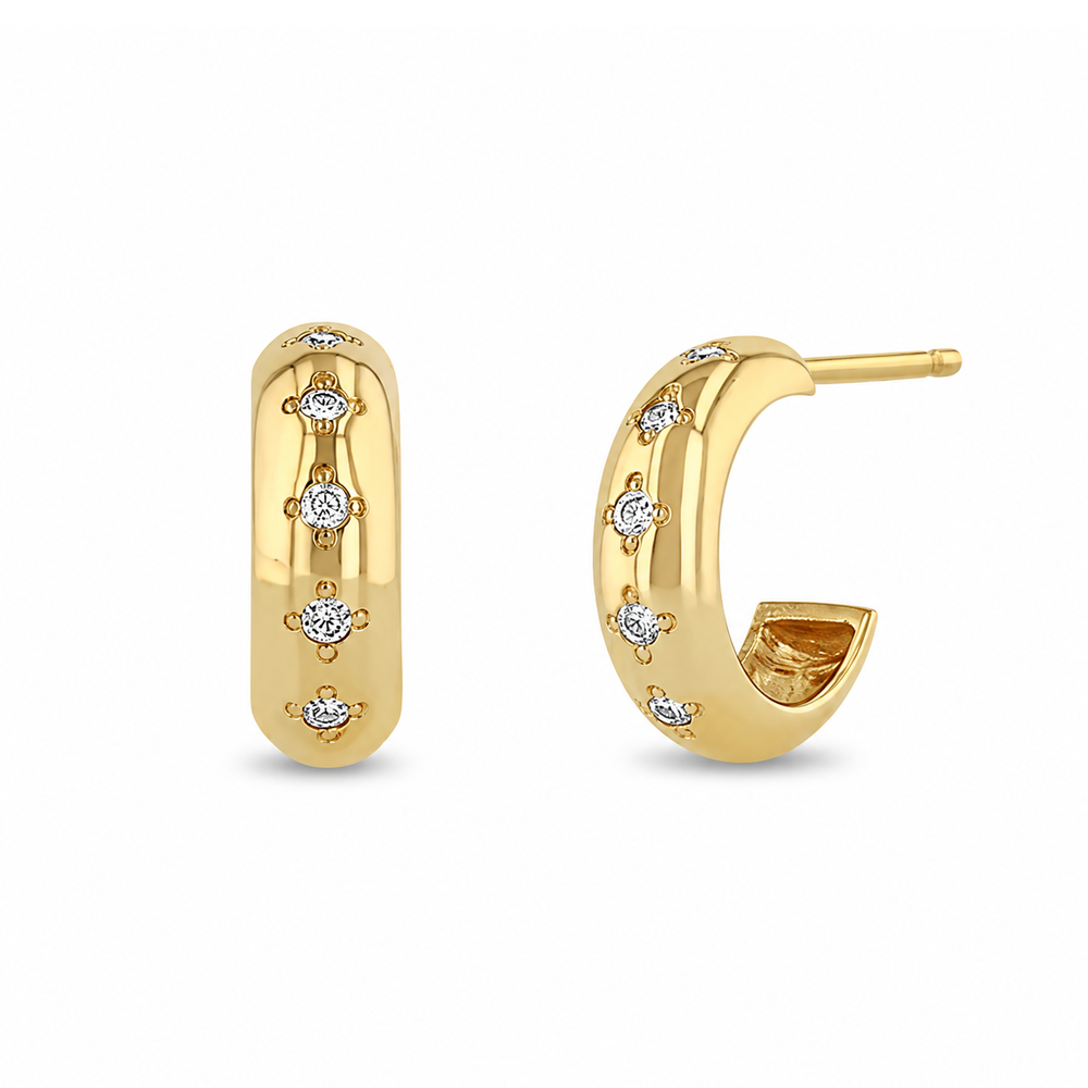 14k yellow gold huggie earrings from Zoe Chicco features five bead set diamonds that total 0.10ctw. Shown on a white background.