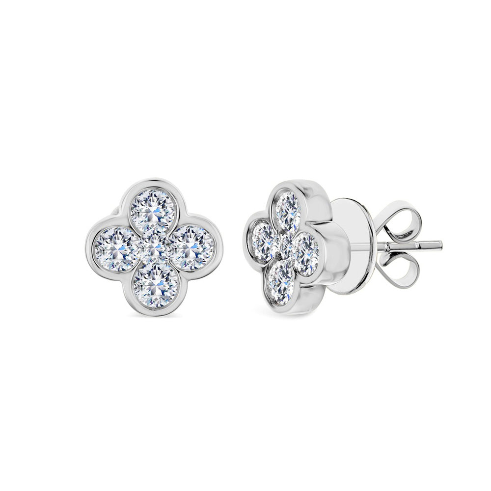 These 18k white gold stud earrings feature a clover shape design with eight round diamonds that total 0.65ctw and two center round diamonds that total 0.10ctw.