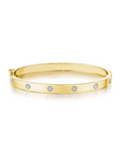 This 18k yellow gold bangle from the Moderne Deco collection by Penny Preville features round diamonds flush set in the bangle that total 0.60ctw. The bangle measures 5.8mm in thickness.