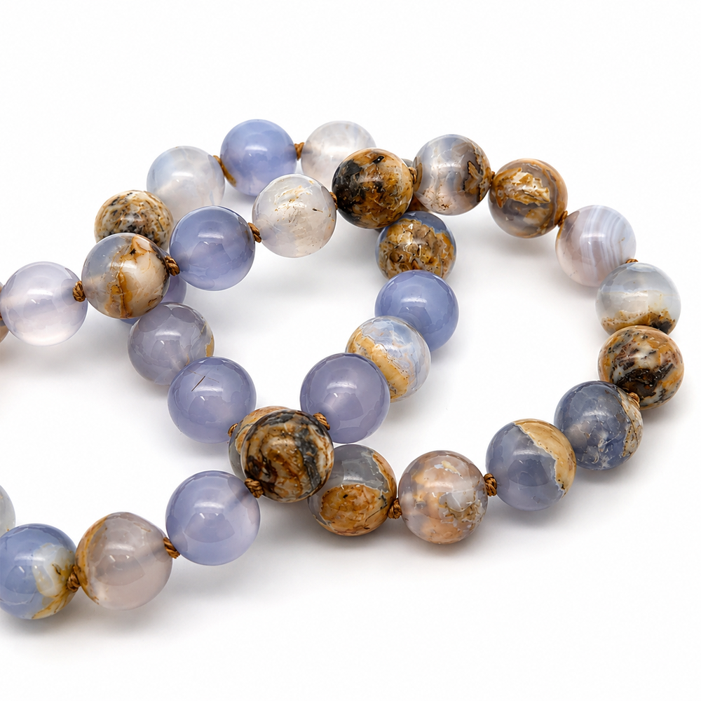 This beaded necklace features a strand of chalcedony stone beads that measure 8mm in diameter each. The 16 inch strand is finished with a sterling silver magnetic ball clasp.