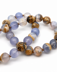 This beaded necklace features a strand of chalcedony stone beads that measure 8mm in diameter each. The 16 inch strand is finished with a sterling silver magnetic ball clasp.