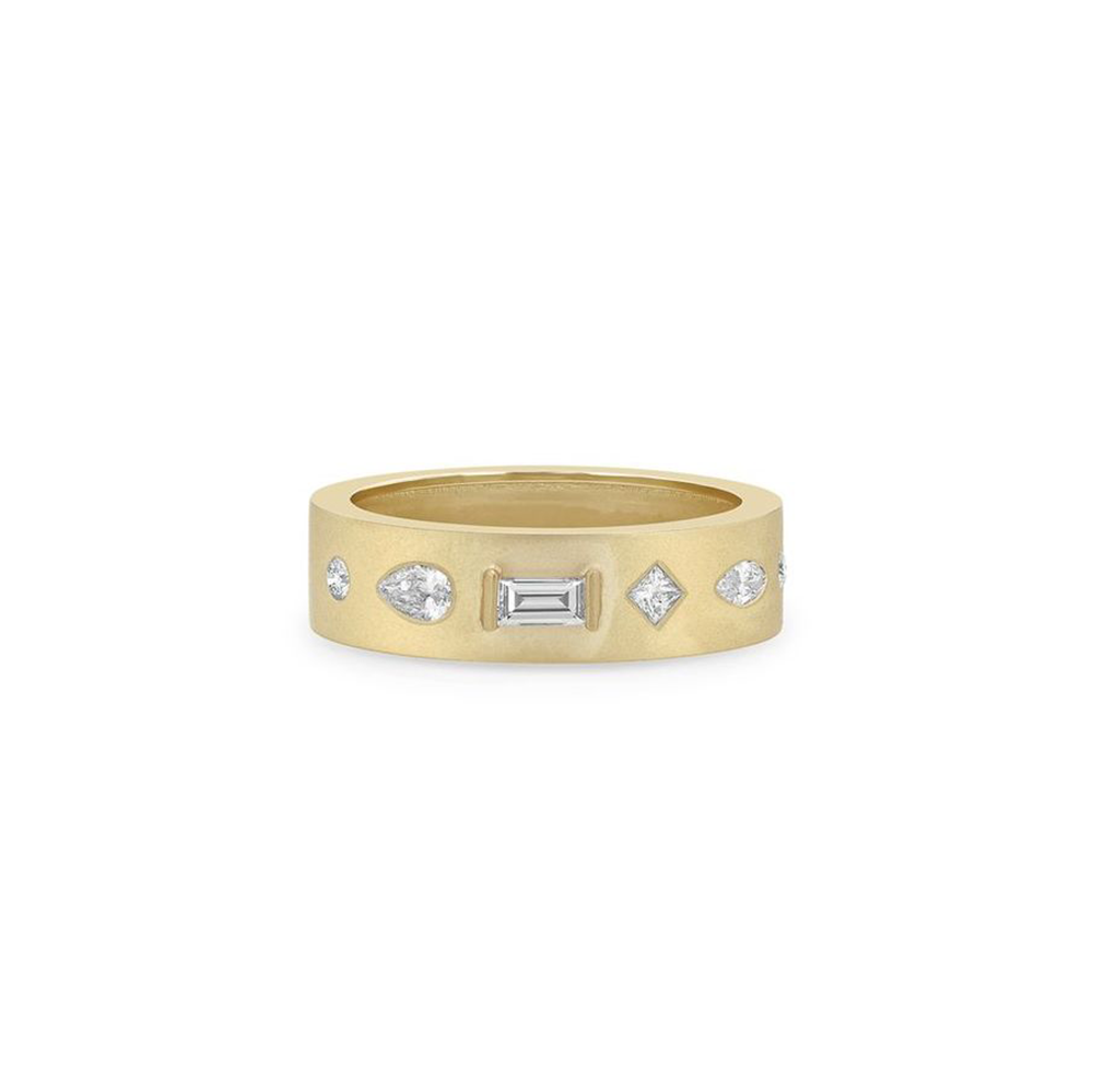 This 14k yellow gold ring from Zoe Chicco features a matte cigar band design with pear, marquise, princess, baguette, and round diamonds that total 0.42ctw. This ring measures 6.5.