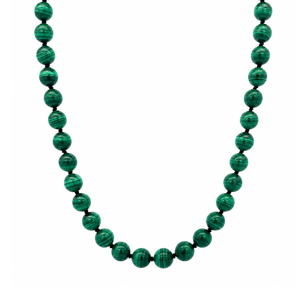 This necklace features malachite beads that measure 8mm each in diameter. This 16 inch strand is finished with a sterling silver magnetic clasp.