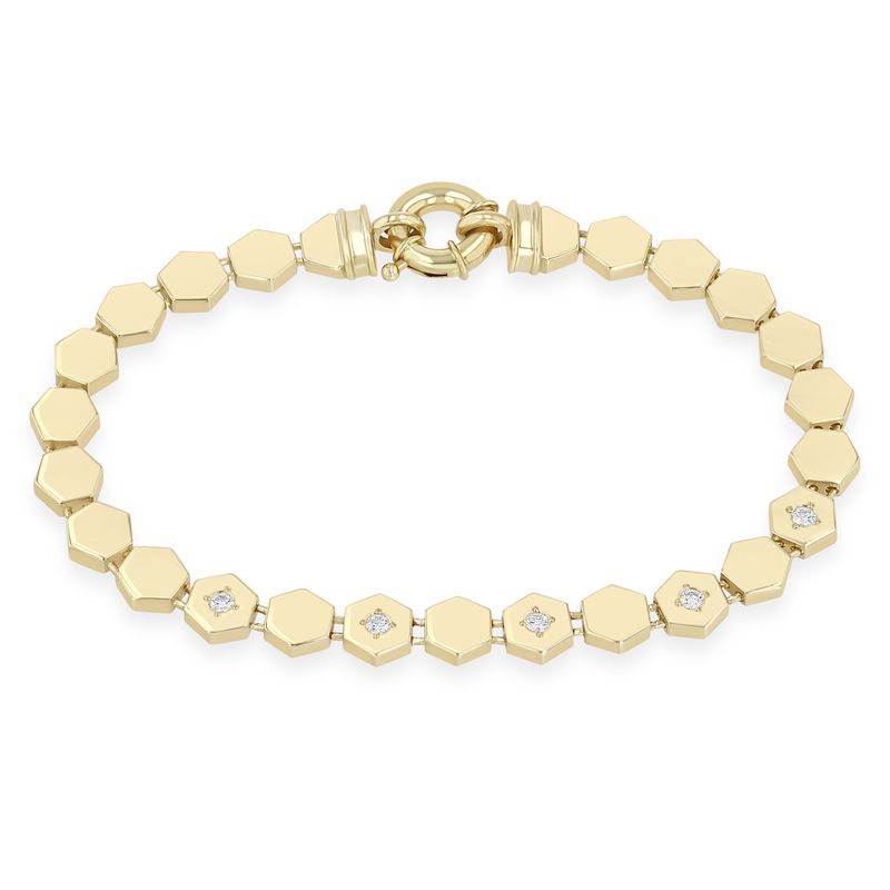 This 14k yellow gold bracelet from Zoe Chicco features hexagon beads with five bead set diamonds that measure 2mm and 0.15ctw. The bracelet measures 6.5 inches in length with a spring ring clasp.