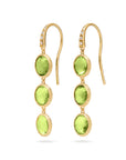 18K yellow gold drop earrings featuring bezel-set, rose-cut round peridot gemstones arranged in a continuous line with hook posts set with diamonds. Displayed on a white background.