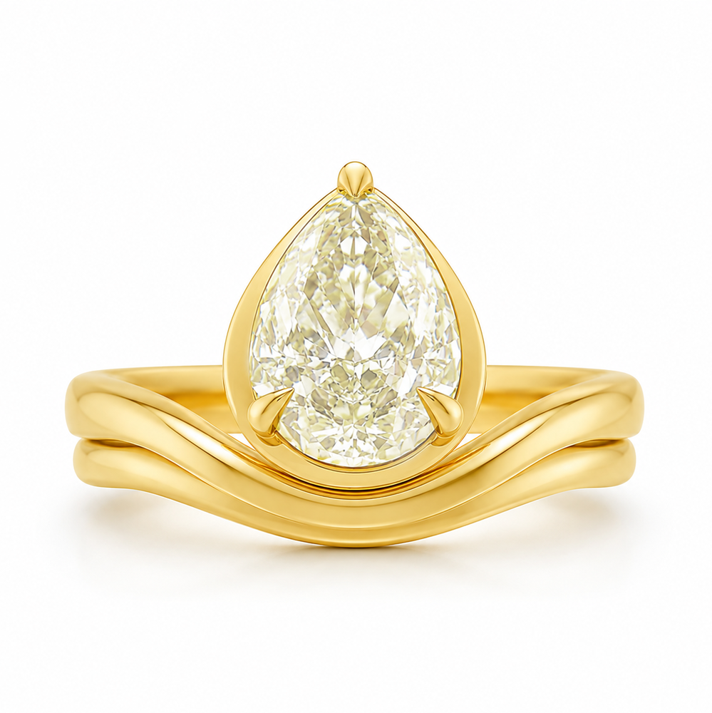 This 18K yellow gold ring features a curved band with a floating, bezel-set pear-shaped diamond totaling 4.04 carats. The diamond falls within the WX range on the color scale, showcasing a warm yellow hue. The ring is a size 6.5.