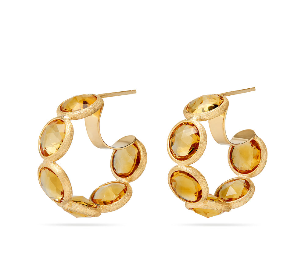 18K yellow gold hoop earrings featuring bezel-set, rose-cut round yellow quartz gemstones arranged in a continuous line. Displayed on a white background.