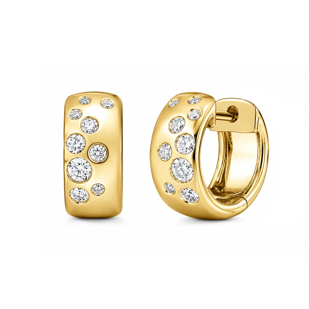 These small huggie earrings from Memoire feature round diamonds set scattered throughout the huggies that total 0.25 to 0.32ctw.