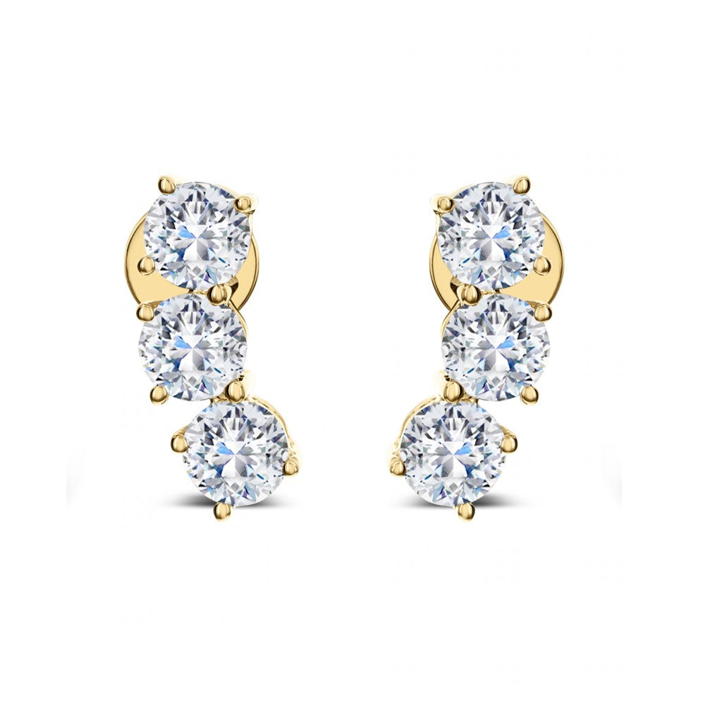 Diamond earrings with three round diamonds.