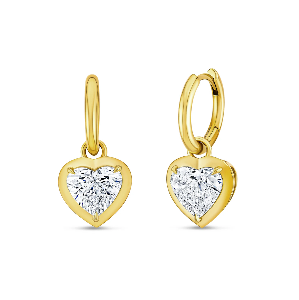 Yellow gold hoop earrings with bezel set diamond hearts dropping.