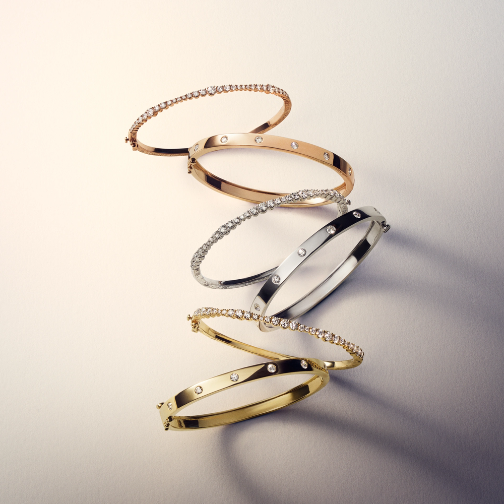 This 18k yellow gold bangle from the Moderne Deco collection by Penny Preville features round diamonds flush set in the bangle that total 0.60ctw. The bangle measures 5.8mm in thickness.