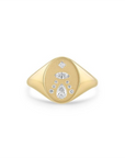 This 14k yellow gold signet ring from Zoe Chicco features an flat oval design with pear, marquise, princess, and round diamonds that total 0.25ctw. This ring measures 6.5.