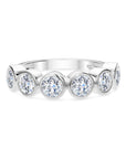 18k white gold band with bezel-set round diamonds.