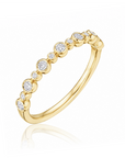 18k yellow gold band with bezel-set round diamonds by Henri Daussi.