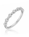 18k white gold band with bezel-set round diamonds by Henri Daussi.