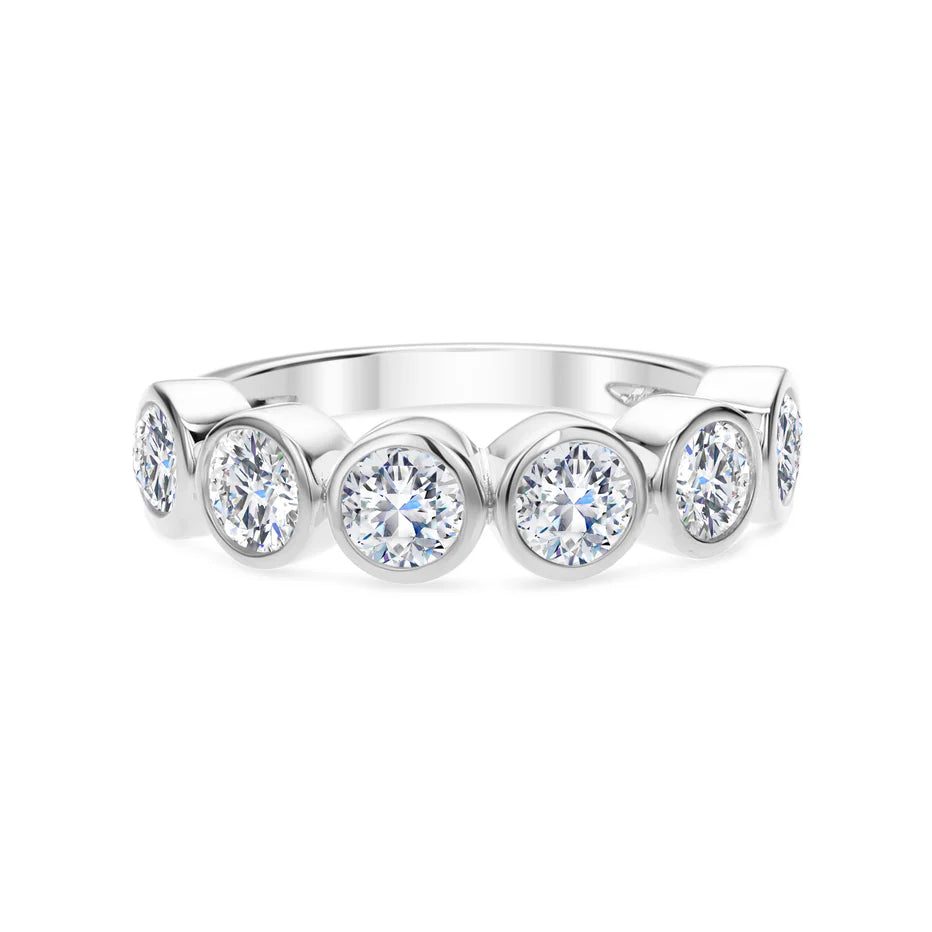 18k white gold band with bezel-set round diamonds.