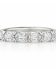 18k white gold band with cushion diamonds by Henri Daussi.