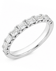 18k white gold half-eternity band featuring baguette-cut diamonds.