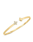 18k yellow gold cuff bangle with diamond flower by Roberto Coin.