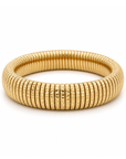 A gold-plated snake skin bangle bracelet with a textured, ribbed pattern, shown on a clean white background.