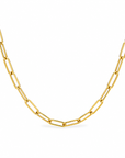A gold paperclip chain necklace displayed in a curved shape against a clean white background.