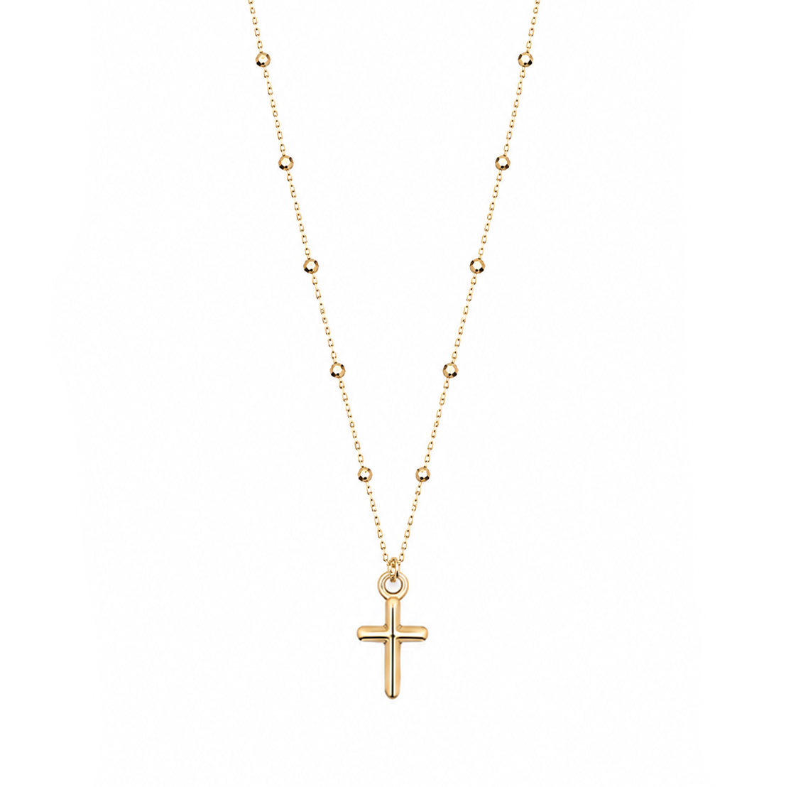 A delicate gold necklace featuring a small cross pendant hanging from a fine chain with small spaced bead accents, shown against a plain white background.