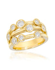 A yellow gold double-band ring set with multiple round-cut clear gemstones, shown on a clean white background with a soft reflection below.