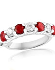 18k white gold band with alternating round rubies and diamonds.