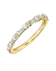 18k yellow gold band with alternating round and baguette diamonds.